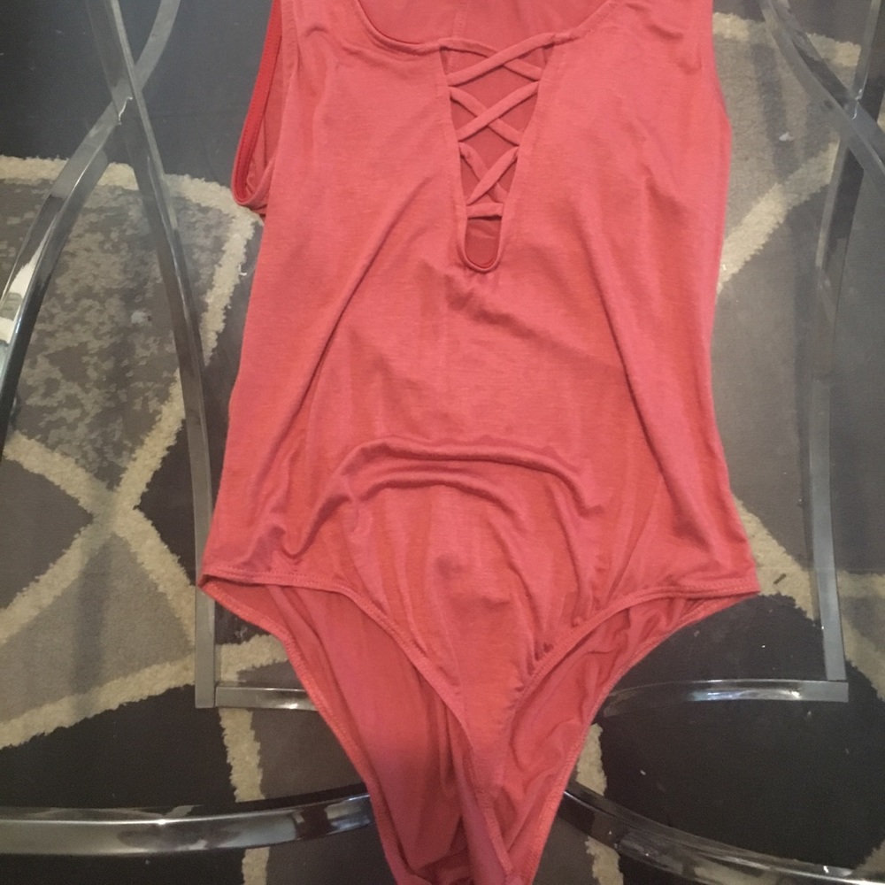 Salmon colored body suit